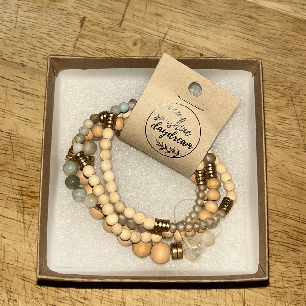 Stack of four beaded bracelets